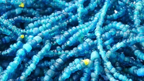 Close up of Ancient rare Blue Tradewind glass Beads Stock Footage 113309018