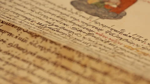 Close-up of ancient religious texts written in ancient Russian. Stock Footage 252751780