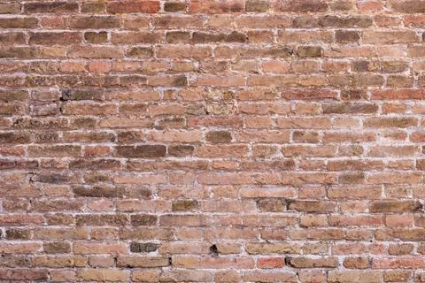 Close-up of ancient stone wall with irregular blocks and earthy colors, sho.. Stock Photos