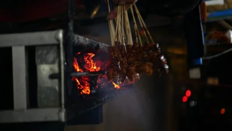 Close up and Eye level view of grilling Indonesian chicken satay in traditi.. Stock-Footage 294276988
