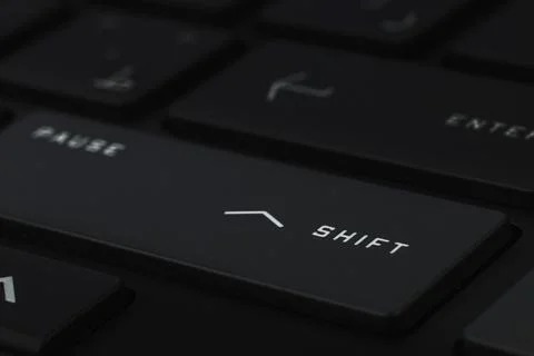 Close-up and full view of a modern computer keyboard, shift key Stock Photos