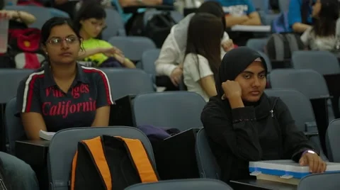 Close Up and Pan Shot of University Students Listening to A Class Lecture Stock Footage 49387520