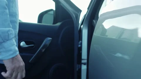 Close up and portrait of old man opening door of his new car enjoying luxury lif Stock Footage 168104775
