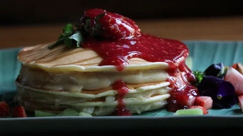 Close up and Rotating around Pancake with fruits on ceramics plate. 스톡 동영상 106001350