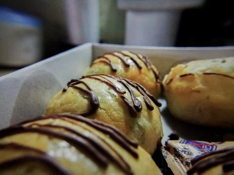 Close up and selective focus of nastar cookies with chocolate topping on oven Stock Photos