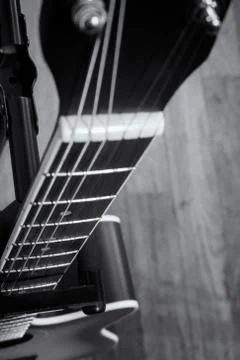 Close-up and selective focus shot image of acoustic guitar on a wooden backgr Foto stock