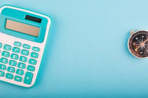 Close-up and selective focus shot, calculator and compass on wooden desk Stock Photos