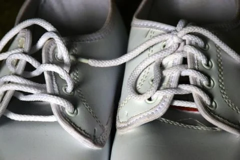 Close up and selective Focus White sneakers, Low key concept, white shoes. Stock Photos