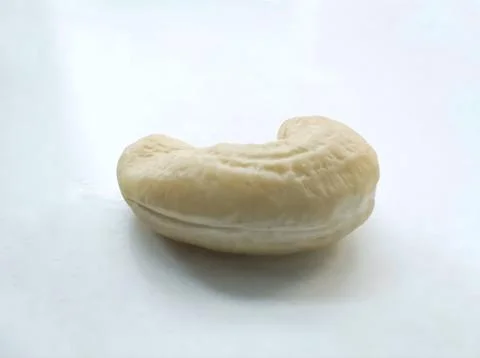 Close-Up and Side View of Single Cashew Nut Isolated on White Background Stock Photos