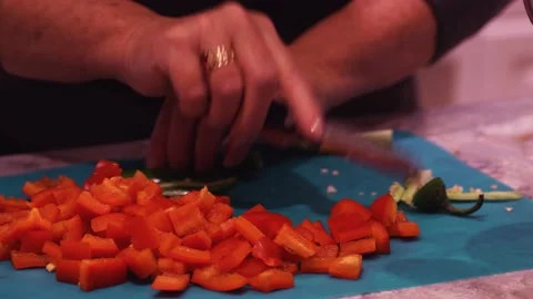 Close up and slo mo of cutting tomatoes and peppers Stock Footage 135950461