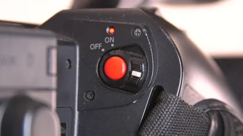 Close up of on and off switch on camcorder Stock Footage 140959674