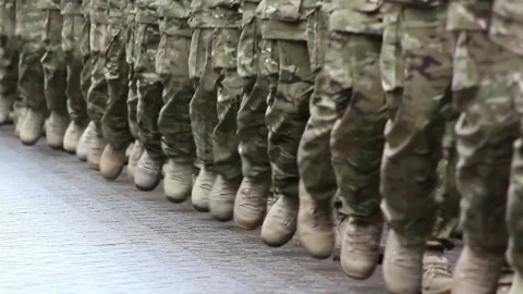 Close angle boots with camouflaged legs marching military march in the parade. Stock Footage 336560361