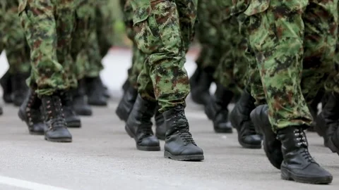 Close angle boots with camouflaged legs marching military march in the parade. Stock Footage 336560549