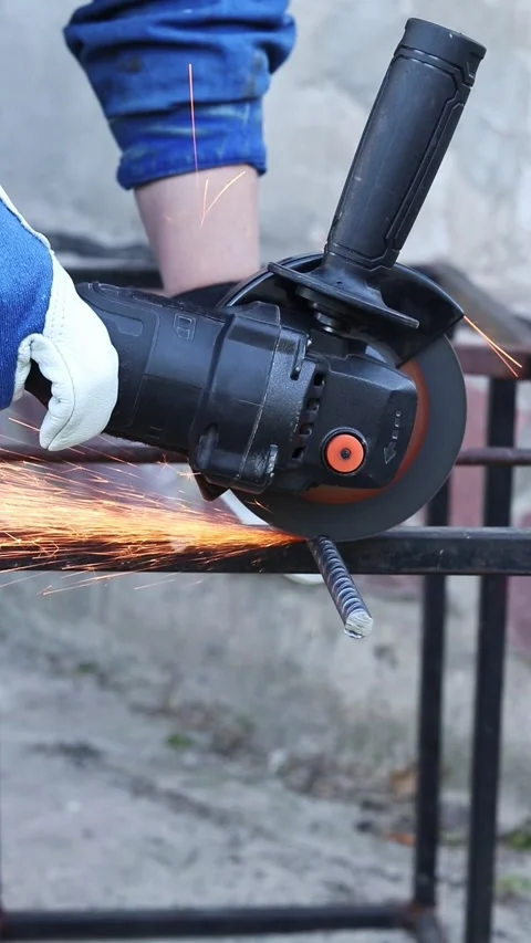 Close-up of an angle grinder cutting rebar Stock Footage 317023425