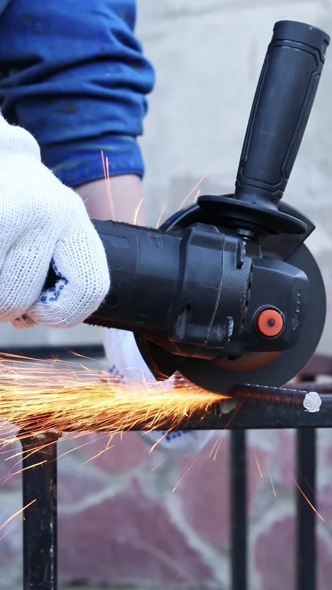 Close-up of an angle grinder cutting rebar Stock Footage 317023496