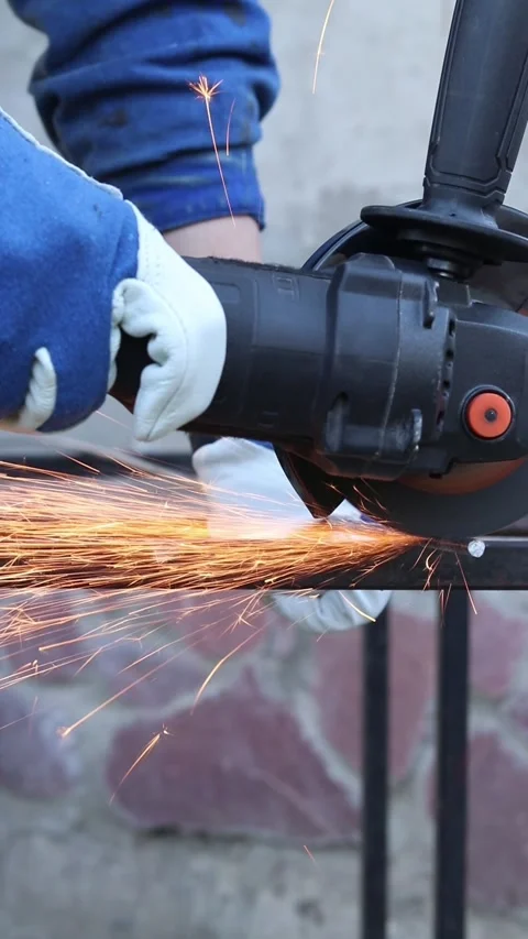 Close-up of an angle grinder cutting rebar Stock Footage 317023502