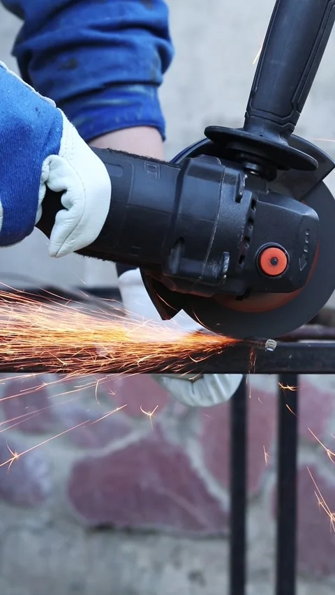 Close-up of an angle grinder cutting rebar Stock Footage 317023533