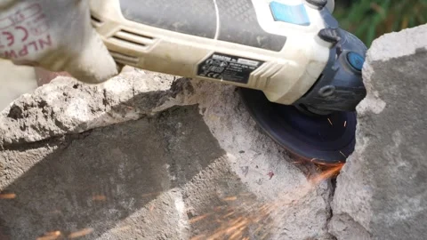 Close up of angle grinder cutting through rebar in slow motion Stock Footage 275297827