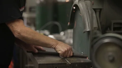 Close up angle grinder in metal shop 60 fps Stock Footage 82441704