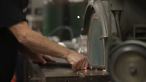 Close up angle grinder in metal shop in slow motion Video stock 82441726