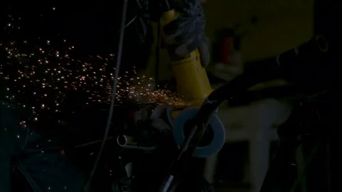 Close up on angle grinder shooting sparks. Slow motion. Stock Footage 69216697