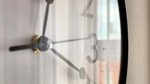 Close-Up Angle of Round Wall Clock Face With Moving Hands on Office Wall Stock Footage 346057251