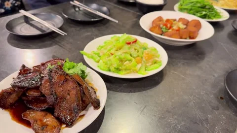 Close Angle of a Shared Taiwanese Family-Style Dinner Table Stock Footage 341452585
