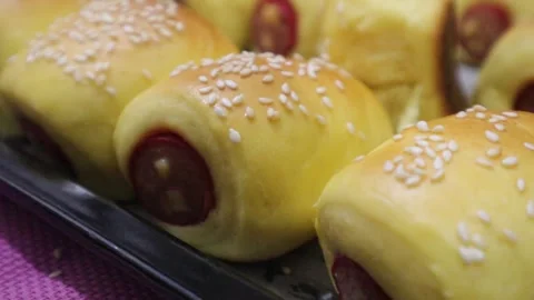 Close angle view of sausauge bread rolls  Stock Footage 328013557