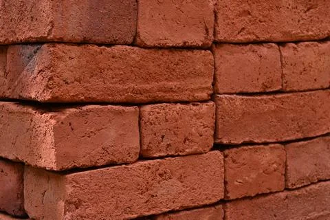 Close up angle view of the stacked fresh bricks Stock Photos