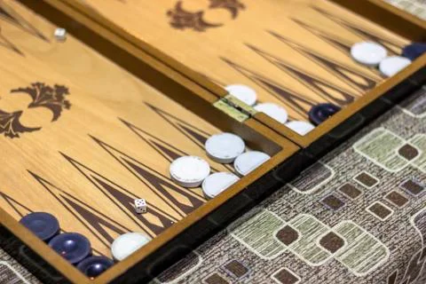 Close-up angled shoot of dice of backgammon under dim light Stock Photos