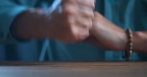 Close-up, an angry man hits the table with his fist, the concept of toughness Stock Footage 230423642