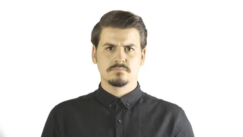 Close-up of angry young man screaming to camera. White background. Stock Footage 76203383