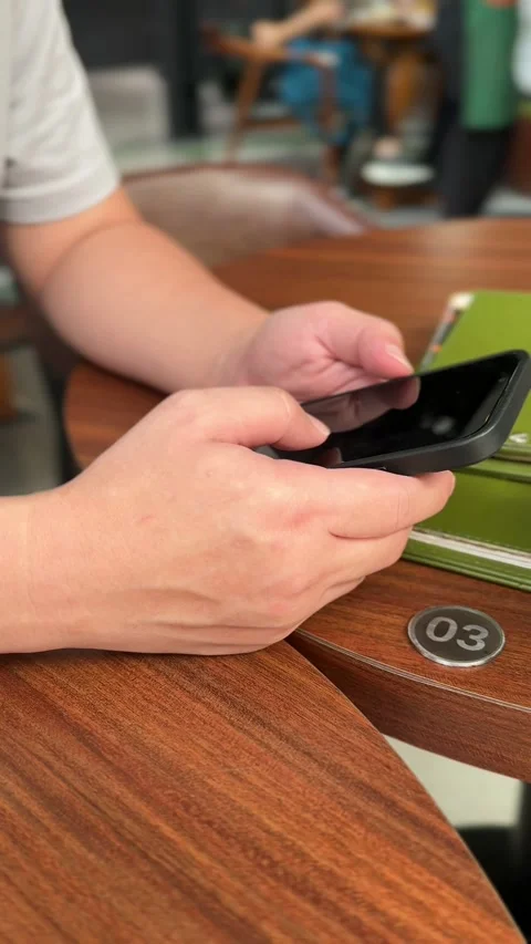 Close Up Of Anonymous Person Using Smartphone In Cafe. 스톡 동영상 335114111