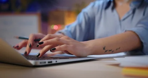 Close up of anonymous woman hands using computer typing and making outlines at Stock-Footage 123674202
