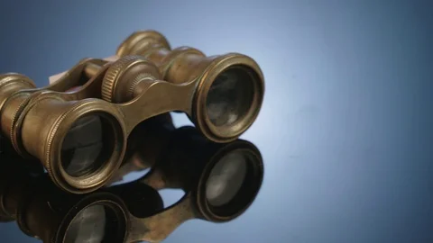 Close up of Antique binoculars on dark reflective background Stock Footage 71633218