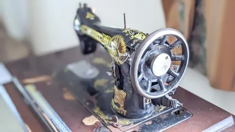 Close-up of An Antique Sewing Machine Placed Near the Window Stock Photos