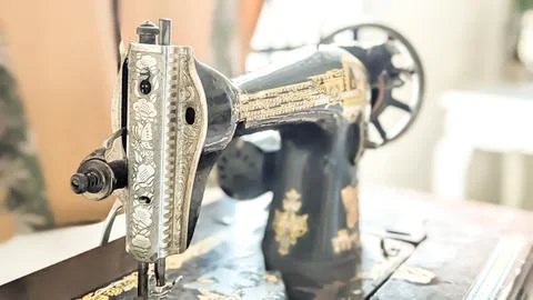 Close-up of An Antique Sewing Machine Placed Near the Window Stock Photos