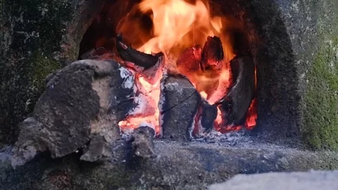 Close-up API, Firewood in a traditional stone stove Stock Footage 302320120