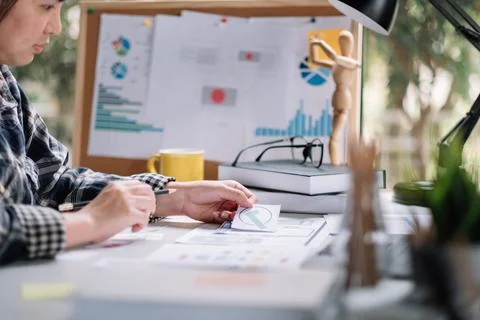 Close up App developer Ux Ui designing with paper model on mobile application Stock Photos