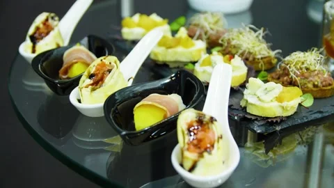 Close-up of appetizers on the buffet table in a restaurant. Buffet food. Canape. Stock Footage 277280838