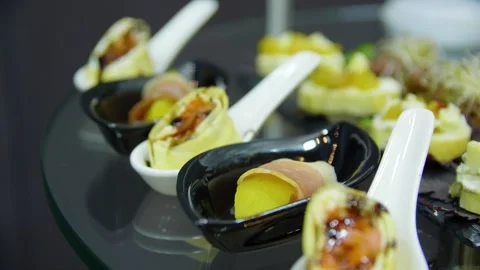 Close-up of appetizers on the buffet table in a restaurant. Buffet food. Canape. Stock Footage 277404111