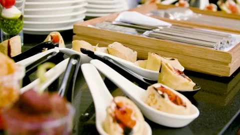 Close-up of appetizers on the buffet table in a restaurant. Buffet food. Canape. Stock Footage 277404159
