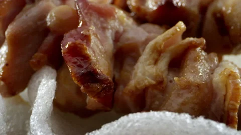 A close-up of an appetizing chicken skewer with bacon and sauce and salad. Close Video stock 138597641