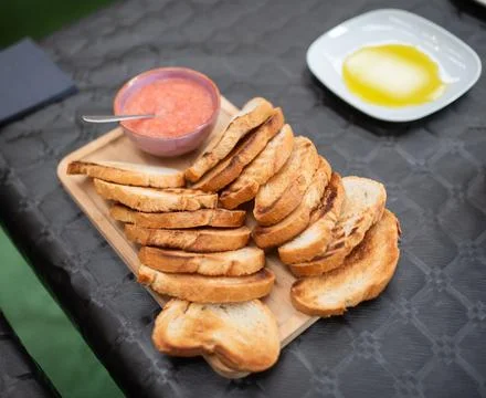 Close-up of appetizing crispy toasts served on a wooden board 스톡 사진
