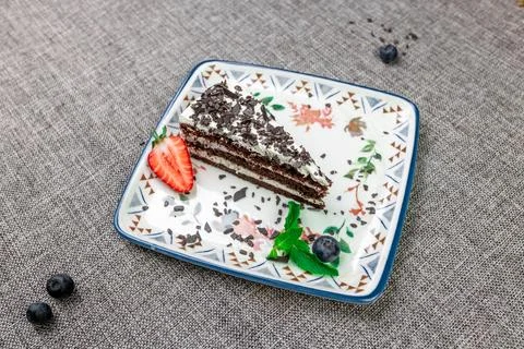 Close-up of appetizing slice of homemade "Black Prince" cake with sour cream, Stock Photos