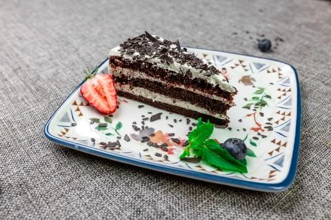 Close-up of appetizing slice of homemade "Black Prince" cake with sour cream, Stock Photos