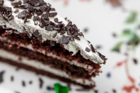 Close-up of appetizing slice of homemade "Black Prince" cake with sour cream, Stock Photos