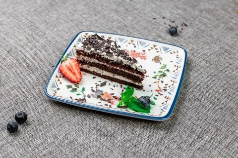 Close-up of appetizing slice of homemade "Black Prince" cake with sour cream, Stock Photos