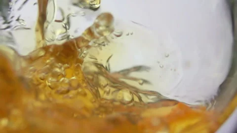 Close-up of apple juice wave pouring into the glass Stock Footage 134268748