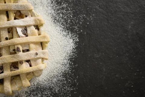 Close up of apple pie amidst flour Stock Photos